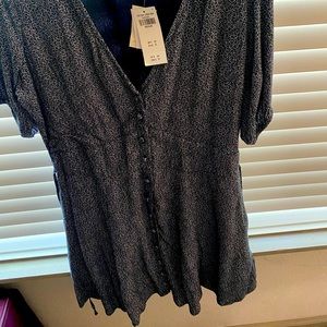 Mini dress with buttons down front. Size Medium